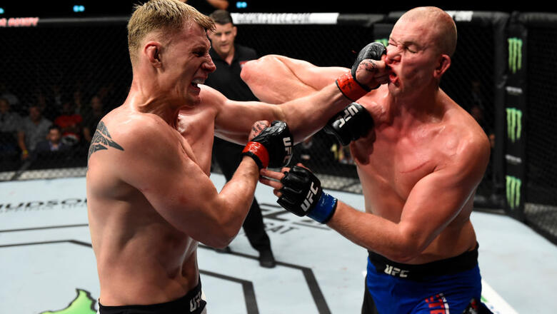 ROTTERDAM, NETHERLANDS - SEPTEMBER 02:  (L-R) Alexander Volkov of Russia punches Stefan Struve of The Netherlands in their heavyweight bout during the UFC Fight Night event at the Rotterdam Ahoy on September 2, 2017 in Rotterdam, Netherlands. (Photo by Jo