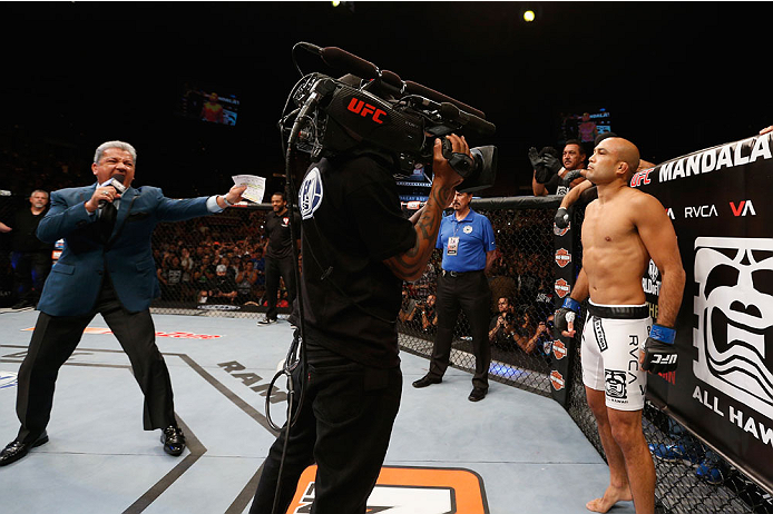 LAS VEGAS, NV - JULY 06: (L-R) UFC announcer Bruce Buffer introduces BJ Penn in his featherweight fight during the Ultimate Fighter Finale inside the Mandalay Bay Events Center on July 6, 2014 in Las Vegas, Nevada. (Photo by Josh Hedges/Zuffa LLC/Zuffa