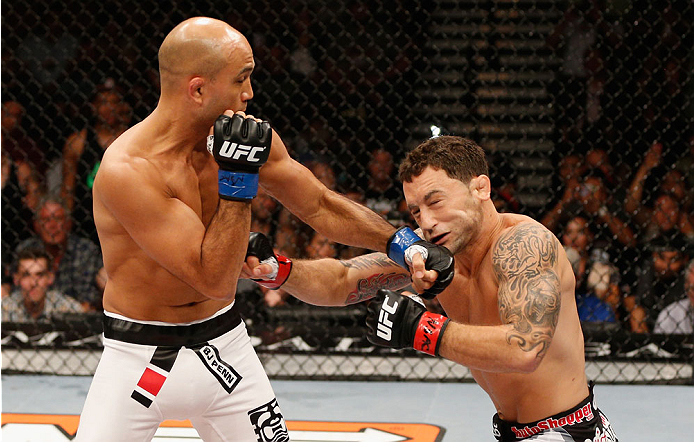 LAS VEGAS, NV - JULY 06: (L-R) BJ Penn and Frankie Edgar exchange punches in their featherweight fight during the Ultimate Fighter Finale inside the Mandalay Bay Events Center on July 6, 2014 in Las Vegas, Nevada. (Photo by Josh Hedges/Zuffa LLC/Zuffa L
