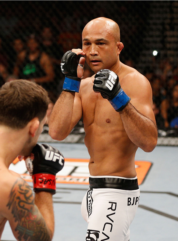 LAS VEGAS, NV - JULY 06: (R-L) BJ Penn squares off with Frankie Edgar