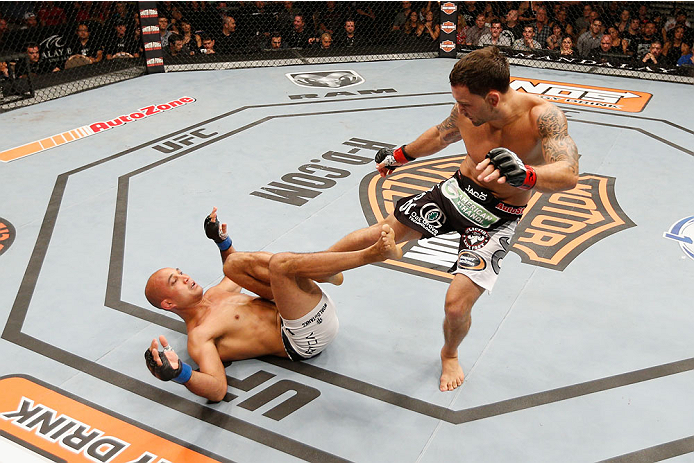 LAS VEGAS, NV - JULY 06: (R-L) Frankie Edgar kicks BJ Penn in their featherweight fight during the Ultimate Fighter Finale inside the Mandalay Bay Events Center on July 6, 2