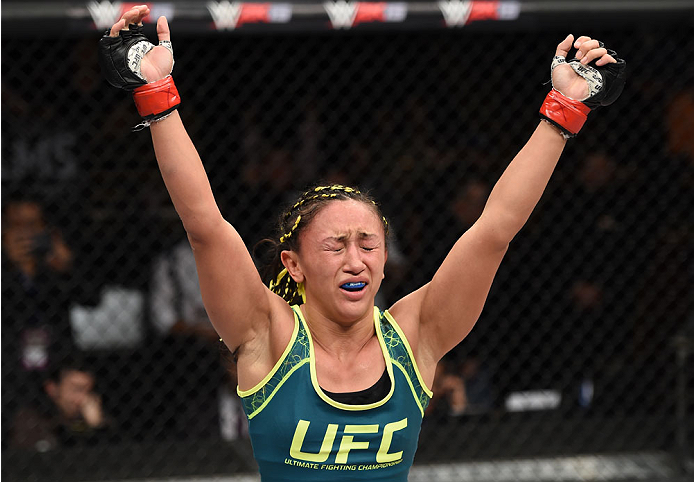 LAS VEGAS, NEVADA - DECEMBER 12: Carla Esparza reacts after submitting Rose Namajunas in their strawweight championship fight during The Ultimate Fighter Finale event inside the Pearl concert theater at the Palms Casino Resort on December 12, 2014 in Las