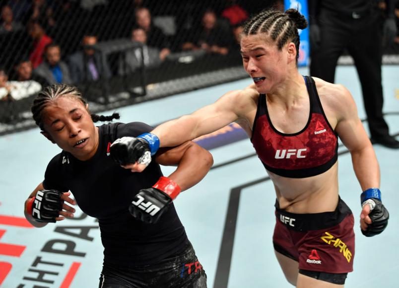 LOS ANGELES, CA - AUGUST 04: (R-L) Weili Zhang of China punches Danielle Taylor in their women's strawweight fight during the UFC 227 event inside Staples Center on August 4, 2018 in Los Angeles, California. (Photo by Jeff Bottari/Zuffa LLC/Zuffa LLC via Getty Images)