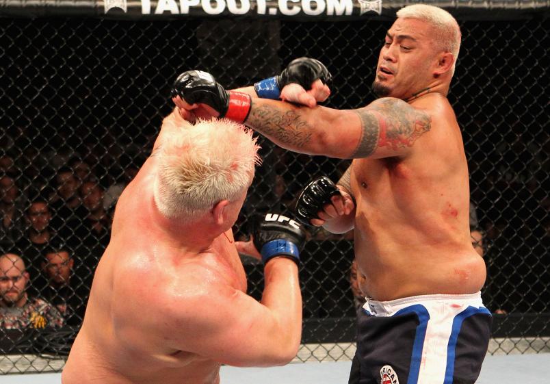 SYDNEY, AUSTRALIA - FEBRUARY 27: Mark Hunt (R) of New Zealand punches Chris Tuchscherer (L) of the USA during their Heavyweight bout at UFC 127 at Acer Arena on February 27, 2011 in Sydney, Australia. (Photo by Josh Hedges/Zuffa LLC/Getty Images)