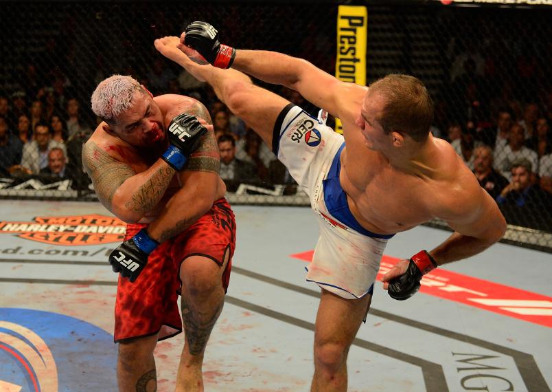 LAS VEGAS, NV - MAY 25: (R-L) Junior dos Santos kicks Mark Hunt in their heavyweight bout during UFC 160 at the MGM Grand Garden Arena on May 25, 2013 in Las Vegas, Nevada. (Photo by Donald Miralle/Zuffa LLC/Zuffa LLC via Getty Images)