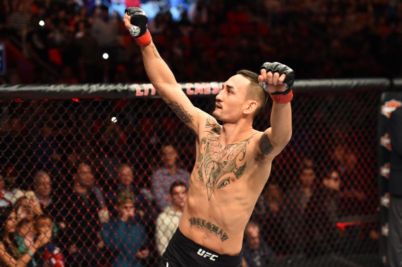 DETROIT, MI - DECEMBER 02: Max Holloway signals to the crowd as he enters the Octagon prior to facing Jose Aldo of Brazil in their UFC featherweight championship bout during the UFC 218 event inside Little Caesars Arena on December 02, 2017 in Detroit, Michigan. (Photo by Josh Hedges/Zuffa LLC/Zuffa LLC via Getty Images)