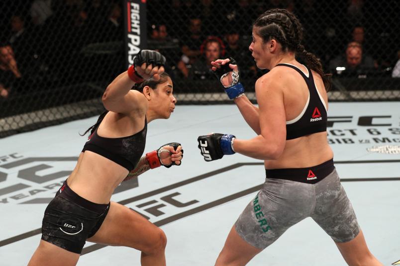 SAO PAULO, BRAZIL - SEPTEMBER 22: (L-R) Livinha Souza of Brazil punches Alex Chambers of Australia in their women's strawweight bout during the UFC Fight Night event at Ibirapuera Gymnasium on September 22, 2018 in Sao Paulo, Brazil. (Photo by Buda Mendes/Zuffa LLC/Zuffa LLC via Getty Images)