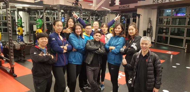 Flyweight Champ Henry Cejudo Poses With Team (Photo by Gavin Porter/Zuffa LLC)