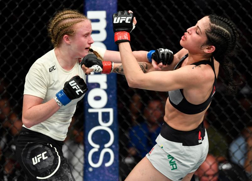 LOS ANGELES, CA - AUGUST 04: (L-R) JJ Aldrich punches Polyana Viana of Brazil in their women's strawweight fight during the UFC 227 event inside Staples Center on August 4, 2018 in Los Angeles, California. (Photo by Jeff Bottari/Zuffa LLC/Zuffa LLC via Getty Images)