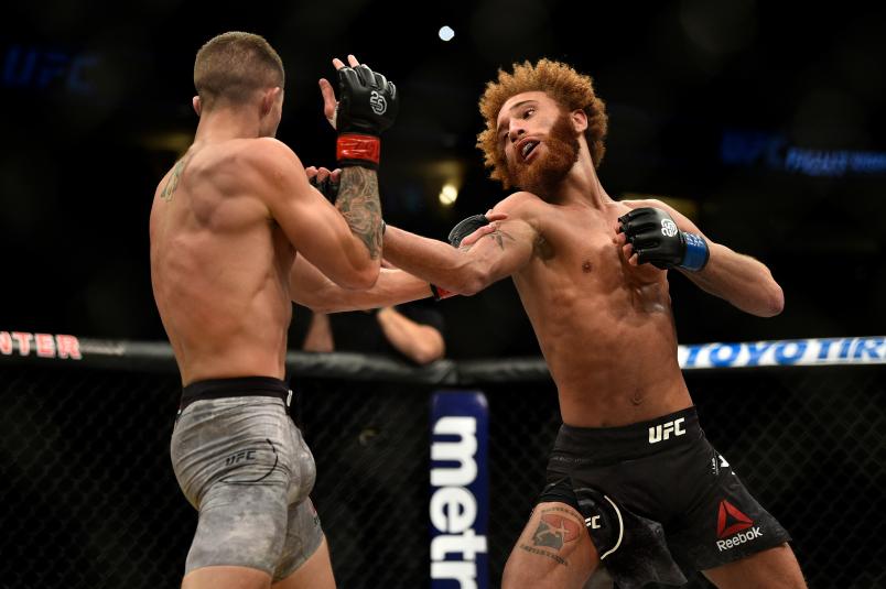 DENVER, CO - NOVEMBER 10: (R-L) Luis Pena punches Michael Trizano in their lightweight bout during the UFC Fight Night event inside Pepsi Center on November 10, 2018 in Denver, Colorado. (Photo by Chris Unger/Zuffa LLC/Zuffa LLC via Getty Images)