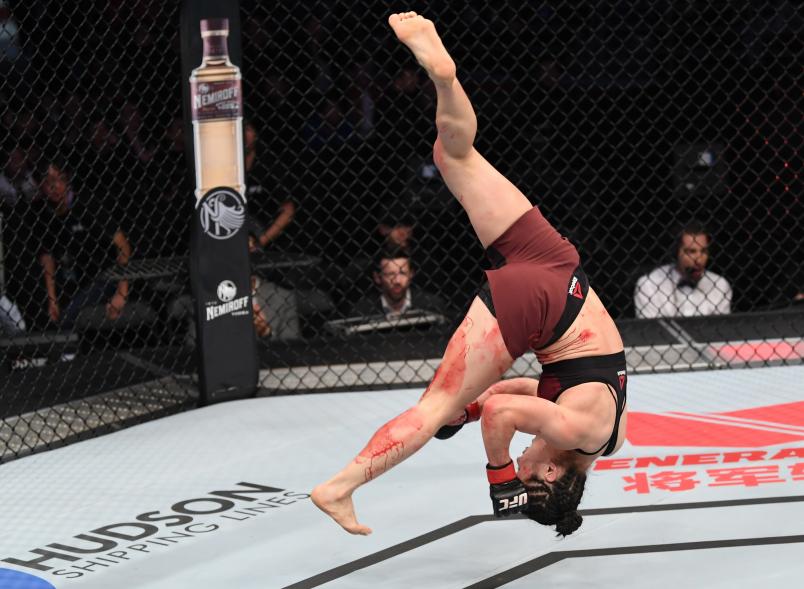 BEIJING, CHINA - NOVEMBER 24: Weili Zhang of China celebrates after her submission victory over Jessica Aguilar in their women's strawweight bout during the UFC Fight Night event inside Cadillac Arena on November 24, 2018 in Beijing, China. (Photo by Jeff Bottari/Zuffa LLC/Zuffa LLC via Getty Images)
