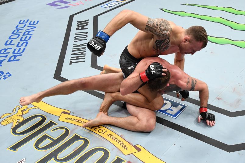 MILWAUKEE, WISCONSIN - DECEMBER 15: Jack Hermansson of Sweden (top) punches Gerald Meerschaert in their middleweight bout during the UFC Fight Night event at Fiserv Forum on December 15, 2018 in Milwaukee, Wisconsin. (Photo by Jeff Bottari/Zuffa LLC/Zuffa LLC via Getty Images)