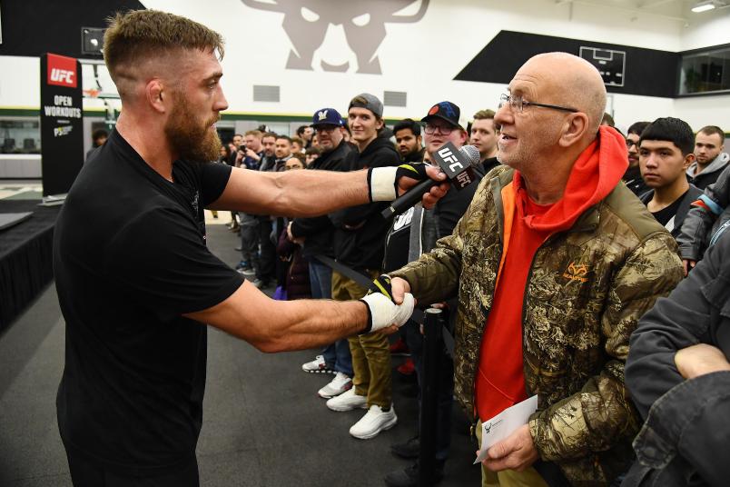 Gerald Meerschaert gives tickets to a fan during open workouts on December 12, 2018 in Milwaukee, Wisconsin. (Photo by Stacy Revere/Zuffa LLC/Zuffa LLC)