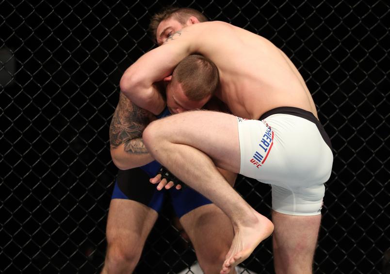(R-L) Gerald Meerschaert knees Joe Gigliotti in their middleweight bout during the UFC Fight Night event at the Times Union Center on December 9, 2016 in Albany, New York. (Photo by Patrick Smith/Zuffa LLC/Zuffa LLC via Getty Images)