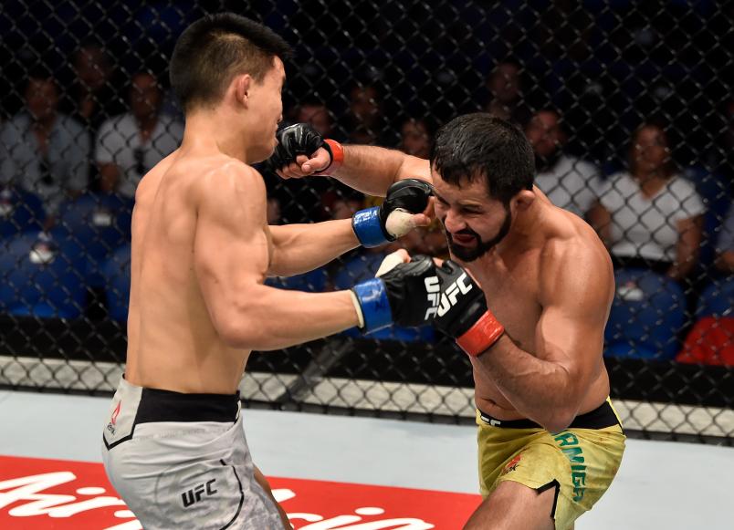 PERTH, AUSTRALIA - FEBRUARY 11: (R-L) Jussier Formiga of Brazil exchanges punches with Ben Nguyen in their flyweight bout during the UFC 221 event at Perth Arena on February 11, 2018 in Perth, Australia. (Photo by Jeff Bottari/Zuffa LLC/Zuffa LLC via Getty Images)