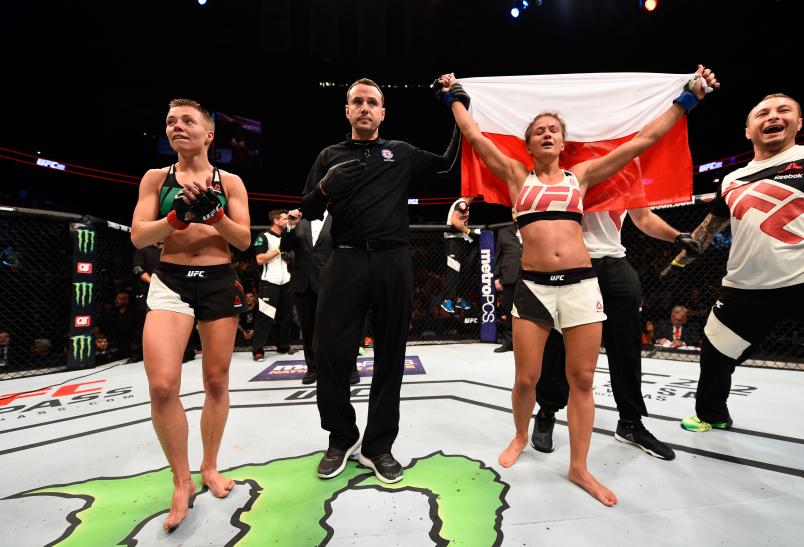 ATLANTA, GA - JULY 30: (R-L) Karolina Kowalkiewicz celebrates her victory over Rose Namajunas in their women's strawweight bout during the UFC 201 event on July 30, 2016 at Philips Arena in Atlanta, Georgia. (Photo by Jeff Bottari/Zuffa LLC/Zuffa LLC via Getty Images)