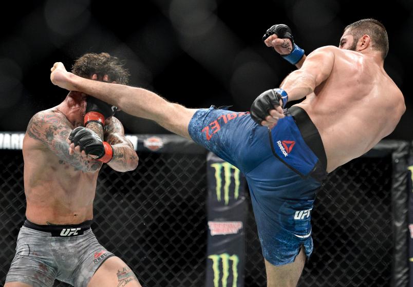 PITTSBURGH, PA - SEPTEMBER 16: (R-L) Jason Gonzalez kicks Gregor Gillespie in their lightweight bout during the UFC Fight Night event inside the PPG Paints Arena on September 16, 2017 in Pittsburgh, Pennsylvania. (Photo by Brandon Magnus/Zuffa LLC/Zuffa LLC via Getty Images)