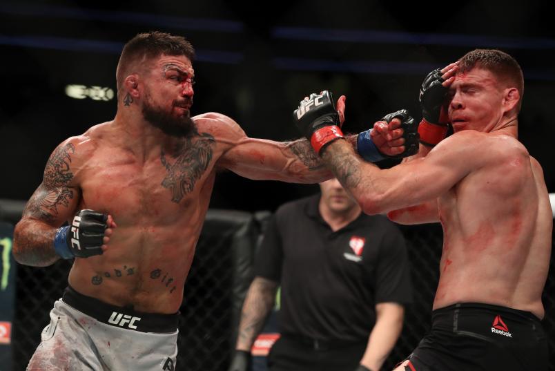 LAS VEGAS, NV - JULY 07: Mike Perry punches Paul Felder in their welterweight fight during the UFC 226 event inside T-Mobile Arena on July 7, 2018 in Las Vegas, Nevada. (Photo by Christian Petersen/Zuffa LLC/Zuffa LLC via Getty Images)