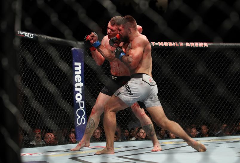 LAS VEGAS, NV - JULY 07: Paul Felder and Mike Perry exchange blows in their welterweight fight during the UFC 226 event inside T-Mobile Arena on July 7, 2018 in Las Vegas, Nevada. (Photo by Christian Petersen/Zuffa LLC/Zuffa LLC via Getty Images)
