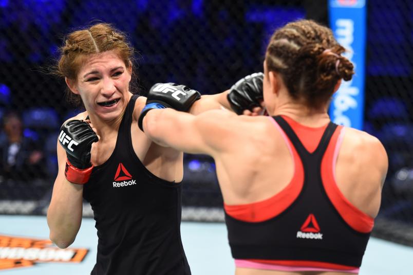 DALLAS, TX - SEPTEMBER 08: (L-R) Irene Aldana of Mexico punches Lucie Pudilova of Czech Republic in their women's bantamweight fight during the UFC 228 event at American Airlines Center on September 8, 2018 in Dallas, Texas. (Photo by Josh Hedges/Zuffa LLC/Zuffa LLC via Getty Images)