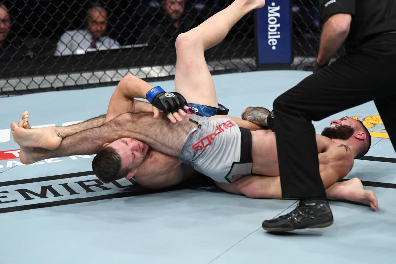 NEW YORK, NY - NOVEMBER 03: (R-L) Shane Burgos submits Kurt Holobaugh in their featherweight bout during the UFC 230 event inside Madison Square Garden on November 3, 2018 in New York, New York. (Photo by Jeff Bottari/Zuffa LLC/Zuffa LLC via Getty Images)