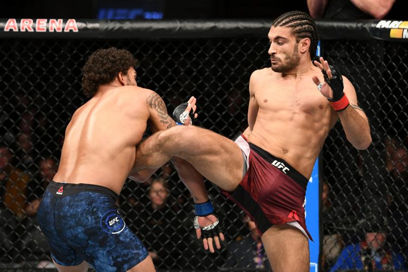 TORONTO, CANADA - DECEMBER 08: (R-L) Elias Theodorou of Canada kicks Eryk Anders in their middleweight fight during the UFC 231 event at Scotiabank Arena on December 8, 2018 in Toronto, Canada. (Photo by Josh Hedges/Zuffa LLC/Zuffa LLC via Getty Images)