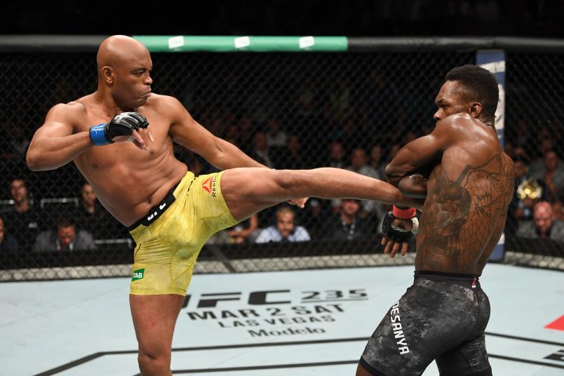 MELBOURNE, AUSTRALIA - FEBRUARY 10: (L-R) Anderson Silva of Brazil kicks Israel Adesanya of New Zealand in their middleweight bout during the UFC 234 at Rod Laver Arena on February 10, 2019 in the Melbourne, Australia. (Photo by Jeff Bottari/Zuffa LLC/Zuffa LLC via Getty Images)