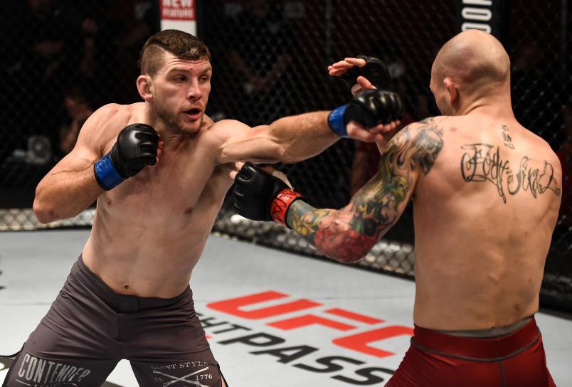 LAS VEGAS, NV - JULY 11: (L-R) Kurt Holobaugh punches Matt Bessette in their featherweight bout during Dana White's Tuesday Night Contender Series at the TUF Gym on July 11, 2017 in Las Vegas, Nevada. (Photo by Brandon Magnus/DWTNCS)