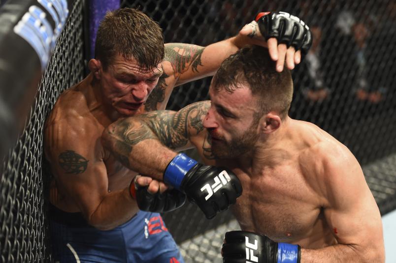 BOISE, ID - JULY 14: (R-L) Alexander Volkanovski of Australia elbows Darren Elkins in their featherweight fight during the UFC Fight Night event inside CenturyLink Arena on July 14, 2018 in Boise, Idaho. (Photo by Josh Hedges/Zuffa LLC/Zuffa LLC via Getty Images)