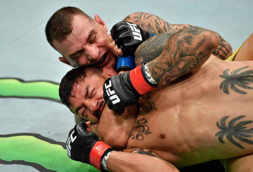 LOS ANGELES, CA - AUGUST 04: (L-R) Renato Moicano of Brazil secures a rear choke submission against Cub Swanson in their featherweight fight during the UFC 227 event inside Staples Center on August 4, 2018 in Los Angeles, California. (Photo by Jeff Bottari/Zuffa LLC/Zuffa LLC via Getty Images)