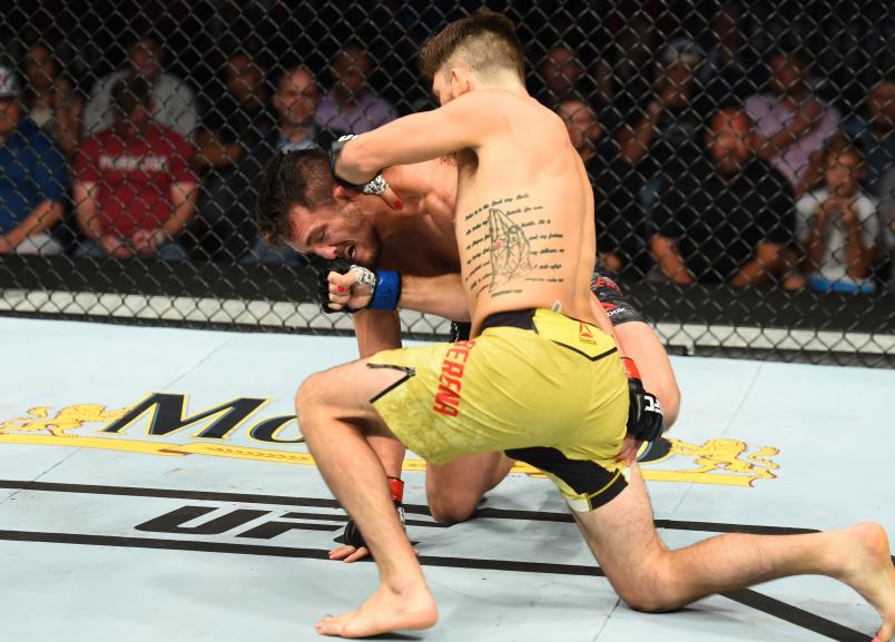 LINCOLN, NE - AUGUST 25: (R-L) Bryan Barberena punches Jake Ellenberger in their welterweight fight during the UFC Fight Night event at Pinnacle Bank Arena on August 25, 2018 in Lincoln, Nebraska. (Photo by Josh Hedges/Zuffa LLC/Zuffa LLC via Getty Images)