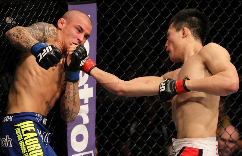 FAIRFAX, VA - MAY 15: (R-L) "The Korean Zombie" Chan Sung Jung punches Dustin Poirier in a featherweight bout during the UFC on Fuel TV event at Patriot Center on May 15, 2012 in Fairfax, Virginia. (Photo by Josh Hedges/Zuffa LLC/Zuffa LLC via Getty Images)