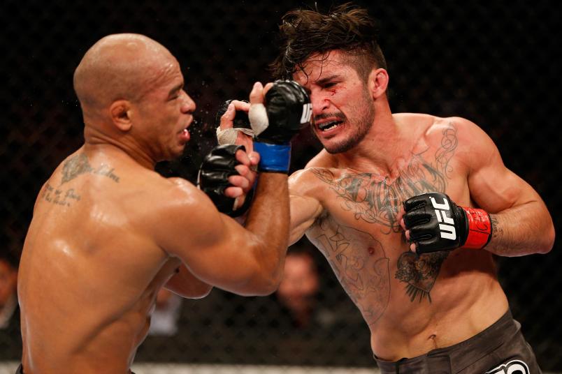 RIO DE JANEIRO, BRAZIL - AUGUST 03: (R-L) Ian McCall punches Illarde Santos in their flyweight bout during UFC 163 at HSBC Arena on August 3, 2013 in Rio de Janeiro, Brazil. (Photo by Josh Hedges/Zuffa LLC/Zuffa LLC via Getty Images)