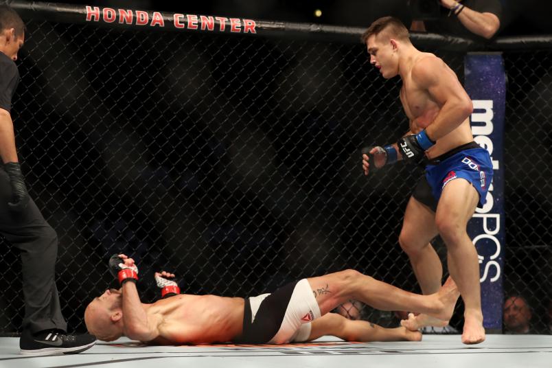 ANAHEIM, CA - JULY 29: Joshua Burkman falls to the mat after being knocked out by Drew Dober in their lightweight bout during the UFC 214 event at Honda Center on July 29, 2017 in Anaheim, California. (Photo by Christian Petersen/Zuffa LLC/Zuffa LLC via Getty Images)