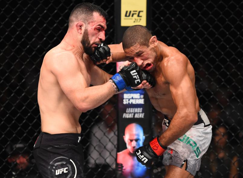 SAO PAULO, BRAZIL - OCTOBER 28: (L-R) Jared Gordon and Hacran Dias of Brazil exchange punches in their lightweight bout during the UFC Fight Night event inside the Ibirapuera Gymnasium on October 28, 2017 in Sao Paulo, Brazil. (Photo by Josh Hedges/Zuffa LLC/Zuffa LLC via Getty Images)