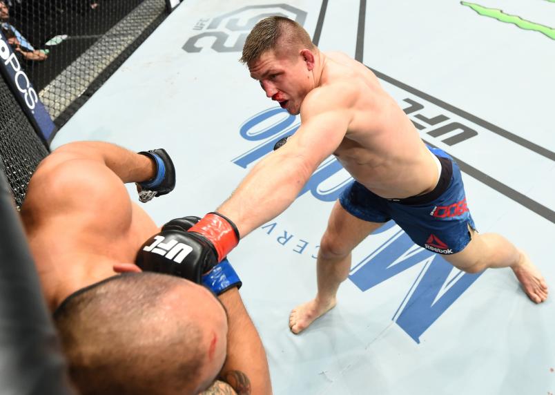 CHARLOTTE, NC - JANUARY 27: (R-L) Drew Dober punches Frank Camacho of Guam in their lightweight bout during a UFC Fight Night event at Spectrum Center on January 27, 2018 in Charlotte, North Carolina. (Photo by Josh Hedges/Zuffa LLC/Zuffa LLC via Getty Images)