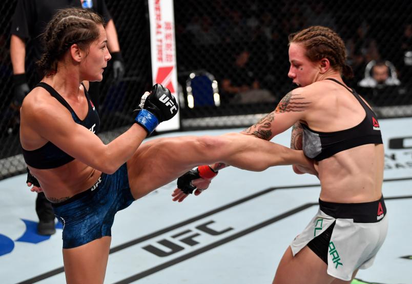 SINGAPORE - JUNE 23: (L-R) Jessica Eye kicks Jessica-Rose Clark of Australia in their women's flyweight bout during the UFC Fight Night event at the Singapore Indoor Stadium on June 23, 2018 in Singapore. (Photo by Jeff Bottari/Zuffa LLC/Zuffa LLC via Getty Images)