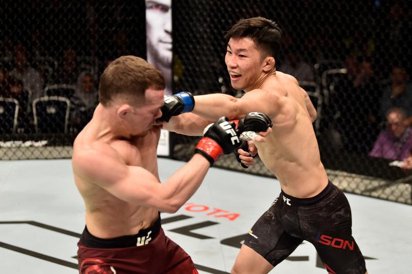 MOSCOW, RUSSIA - SEPTEMBER 15: (R-L) Jin Soon Son of South Korea punches Petr Yan of Russia in their bantamweight bout during the UFC Fight Night event at Olimpiysky Arena on September 15, 2018 in Moscow, Russia. (Photo by Jeff Bottari/Zuffa LLC/Zuffa LLC via Getty Images)