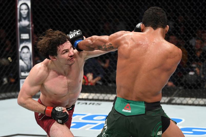 TORONTO, CANADA - DECEMBER 08: (L-R) Olivier Aubin-Mercier of Canada punches Gilbert Burns of Brazil in their lightweight fight during the UFC 231 event at Scotiabank Arena on December 8, 2018 in Toronto, Canada. (Photo by Josh Hedges/Zuffa LLC/Zuffa LLC via Getty Images)