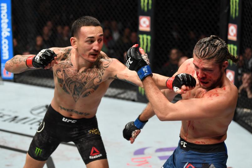 Max Holloway punches Brian Ortega in their UFC featherweight championship fight during the UFC 231 event at Scotiabank Arena on December 8, 2018 in Toronto, Canada. (Photo by Josh Hedges/Zuffa LLC/Zuffa LLC via Getty Images)