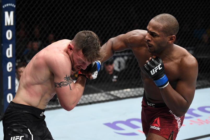 Mike Rodriguez punches Adam Milstead in their light heavyweight bout during the UFC Fight Night event at Fiserv Forum on December 15, 2018 in Milwaukee, Wisconsin. (Photo by Jeff Bottari/Zuffa LLC)