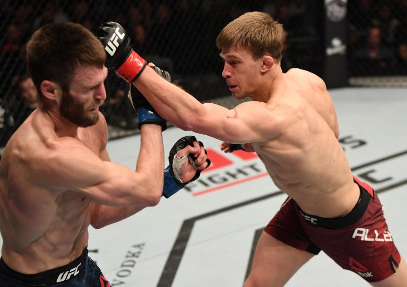 LONDON, ENGLAND - MARCH 16: (R-L) Arnold Allen of England punches Jordan Rinaldi in their featherweight bout during the UFC Fight Night event at The O2 Arena on March 16, 2019 in London, England. (Photo by Jeff Bottari/Zuffa LLC/Zuffa LLC via Getty Images)