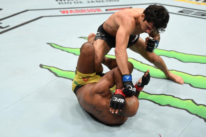Alexandre Pantoja of Brazil punches Wilson Reis of Brazil in their flyweight bout during the UFC 236 event at State Farm Arena on April 13, 2019 in Atlanta, Georgia. (Photo by Josh Hedges/Zuffa LLC/Zuffa LLC via Getty Images)