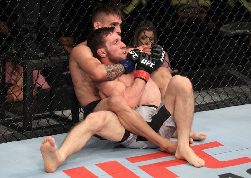 FORTALEZA, BRAZIL - FEBRUARY 02: (L-R) Rogerio Bontorin of Brazil attempts to secure a rear choke submission against Magomed Bibulatov of Russia in flyweight bantamweight fight during the UFC Fight Night event at CFO Centro de Formacao Olimpica on February 2, 2019 in Fortaleza, Brazil. (Photo by Buda Mendes/Zuffa LLC/Zuffa LLC via Getty Images)
