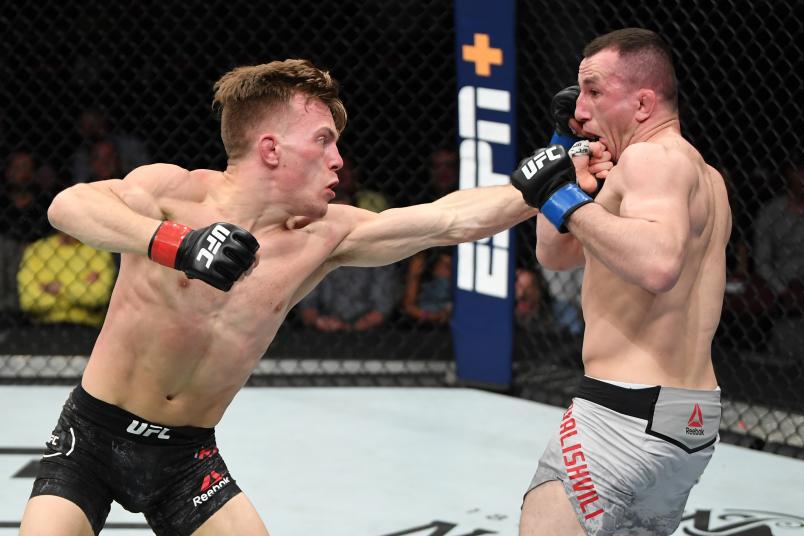 OTTAWA, ON - MAY 04: (L-R) Brad Katona of Canada punches Merab Dvalishvili of Georgia in their bantamweight bout during the UFC Fight Night event at Canadian Tire Centre on May 4, 2019 in Ottawa, Ontario, Canada. (Photo by Jeff Bottari/Zuffa LLC)