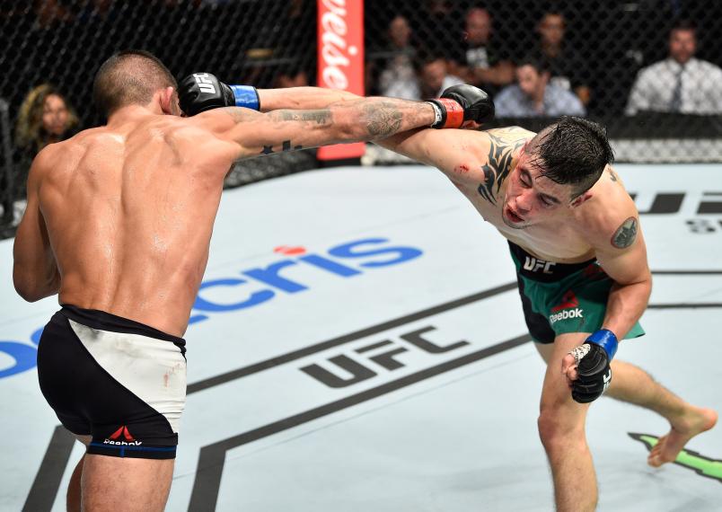 MEXICO CITY, MEXICO - AUGUST 05: (R-L) Sergio Pettis exchanges punches with Brandon Moreno of Mexico in their flyweight bout during the UFC Fight Night event at Arena Ciudad de Mexico on August 5, 2017 in Mexico City, Mexico. (Photo by Jeff Bottari/Zuffa LLC/Zuffa LLC via Getty Images)