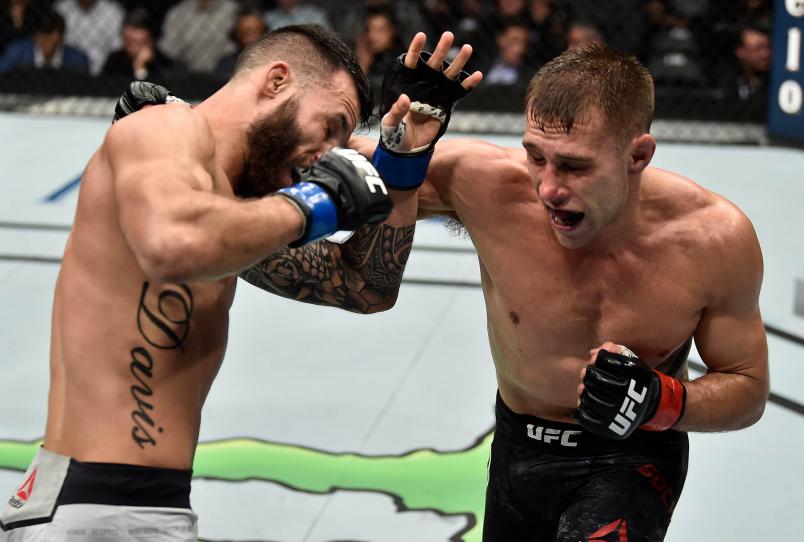 Kyle Bochniak punches Brandon Davis in their featherweight bout during the UFC 220 event at TD Garden on January 20, 2018 in Boston, Massachusetts. (Photo by Jeff Bottari/Zuffa LLC)
