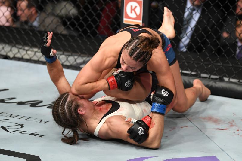 Maycee Barber land an elbow to the head of Hannah Cifers in their women's strawweight bout during the UFC Fight Night event inside Pepsi Center on November 10, 2018 in Denver, Colorado. (Photo by Josh Hedges/Zuffa LLC/Zuffa LLC via Getty Images)
