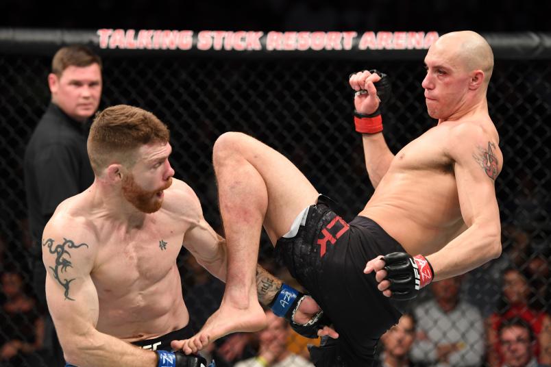 PHOENIX, ARIZONA - FEBRUARY 17: (R-L) James Vick knees Paul Felder in their lightweight bout during the UFC Fight Night event at Talking Stick Andre Fili, Myles Jury Arena on February 17, 2019 in Phoenix, Arizona. (Photo by Josh Hedges/Zuffa LLC/Zuffa LLC via Getty Images)