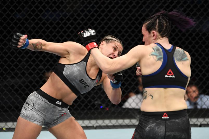 NASHVILLE, TENNESSEE - MARCH 23: (L-R) Jennifer Maia of Brazil punches Alexis Davis of Canada in their women's flyweight bout during the UFC Fight Night event at Bridgestone Arena on March 23, 2019 in Nashville, Tennessee. (Photo by Jeff Bottari/Zuffa LLC/Zuffa LLC via Getty Images)
